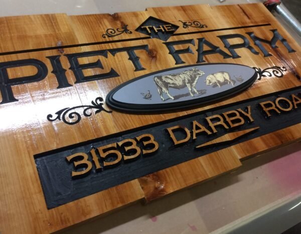 Custom Signage – Piet Farms Entrance sign cnc carved cedar wood with printed oval medallion by Skywatch Signs.