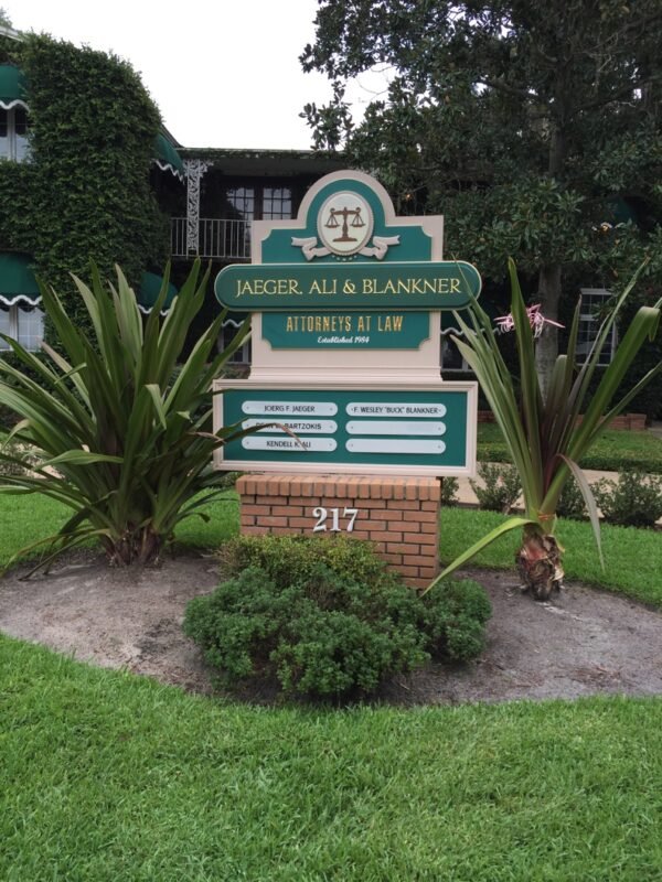 Custom Signage – Monument Sign with brick base Landscaped by Skywatch Signs