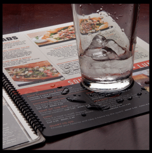 Sanitizable waterproof restaurant menu printed on synthetic paper with water droplets